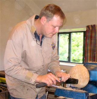 Simon shear scraping a final finishing cut to his first piece of the day